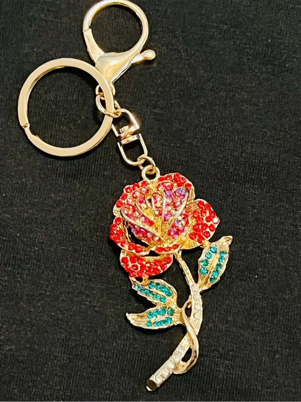 Gold-Tone Rose Bag Charm with Red Crystal Petals and Teal Leaves.       NWT